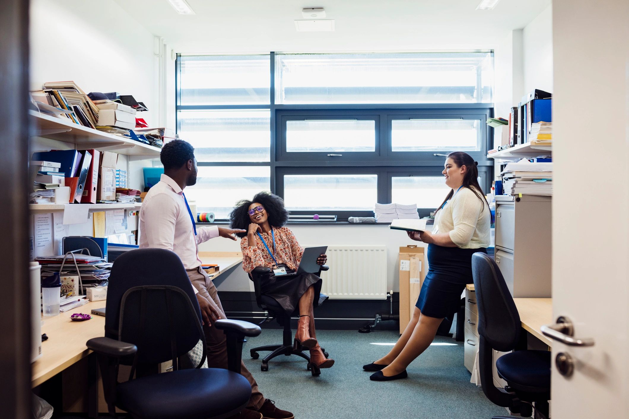 Business team collaborating in an office to represent insurance operations