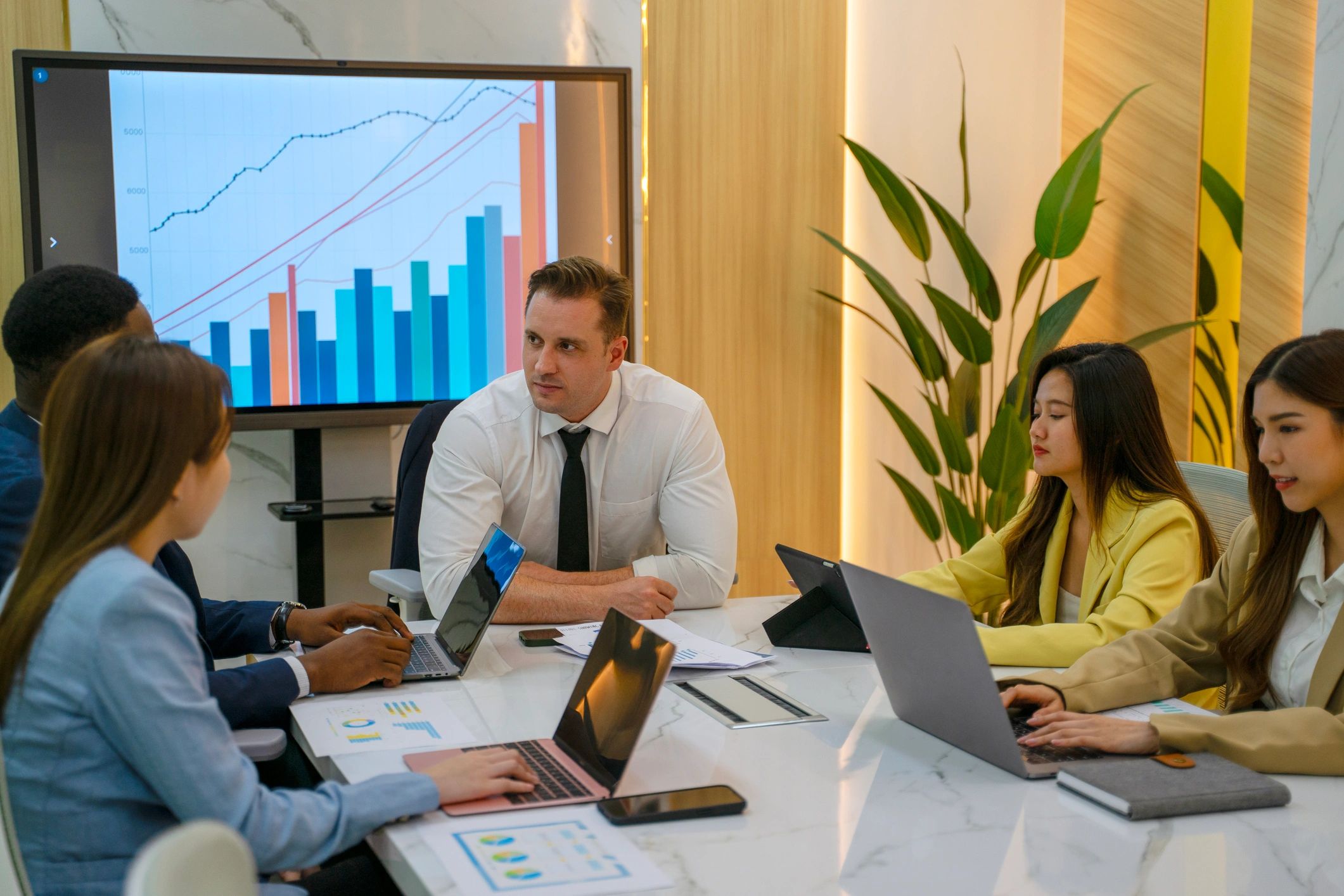 Business team meeting with laptops